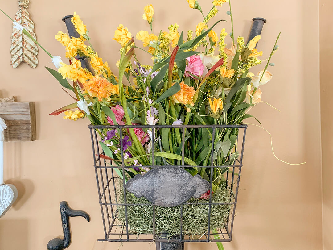 spring flowers in a bike basket